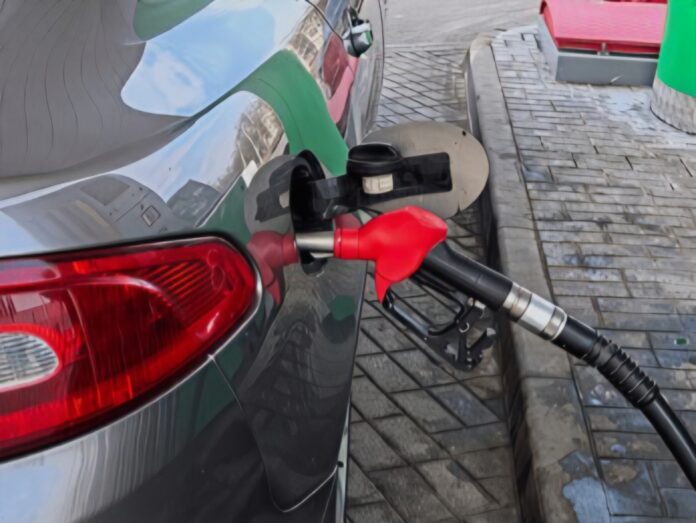 closeup-red-fuel-nozzle-refueling-260nw-2761148539